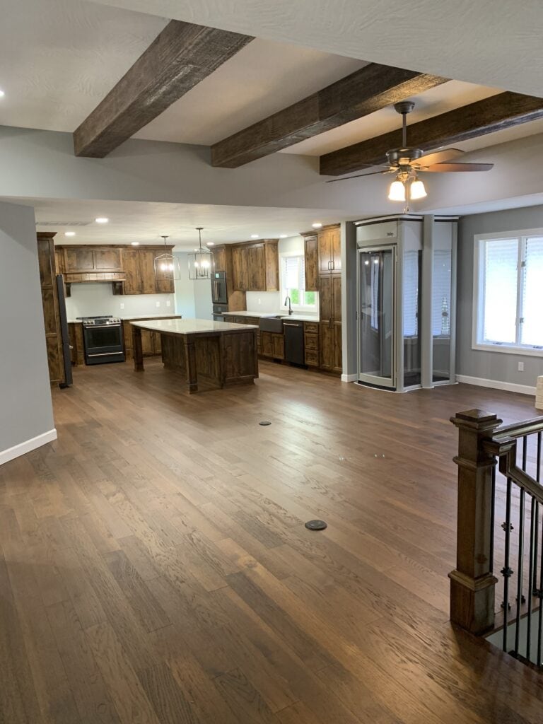 Spacious kitchen with wooden cabinets, island, and modern appliances.