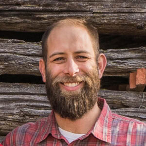 A portrait of Alex Smith, founder of Copper Creek Builders.